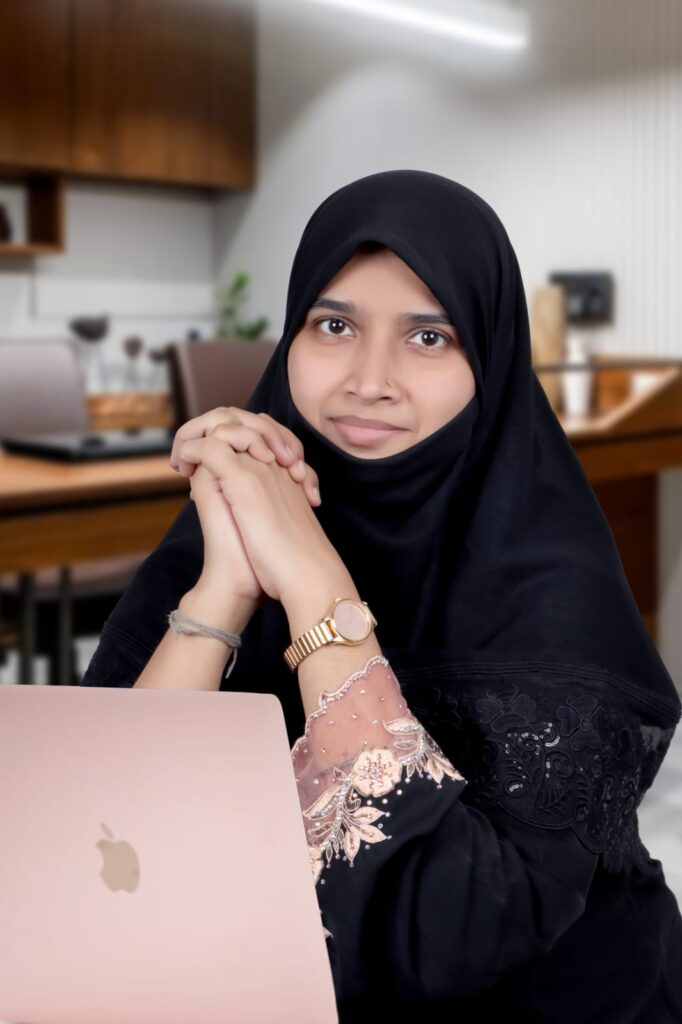 Woman working on babywear stitching and packaging at Sigur Babywear