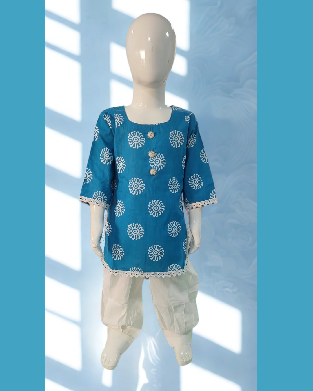 Aaftab baby girl kurti set, blue base, white sun-motif batik print - front view
