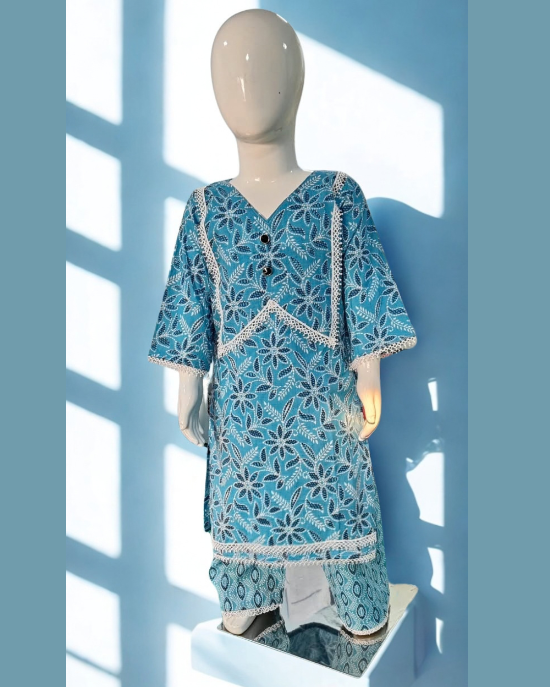 Firoza baby girl kurti set, teal base, white floral print, white lace V-neckline, silver gota trim - front view