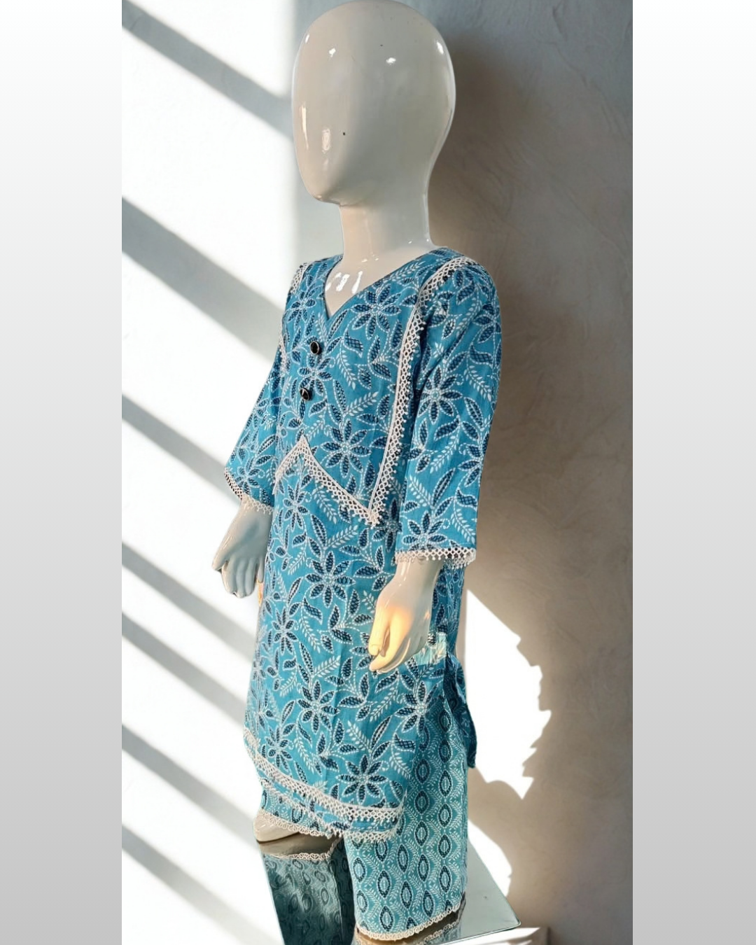 Firoza baby girl kurti set, teal base, white floral print, white lace V-neckline, silver gota trim - side view