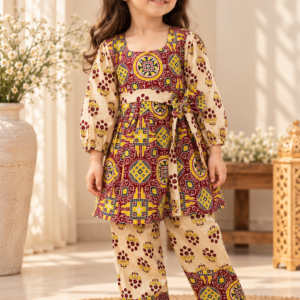 Gulnar baby girl kurti set, red and yellow on cream, bold geometric paisley print - worn by a baby girl model