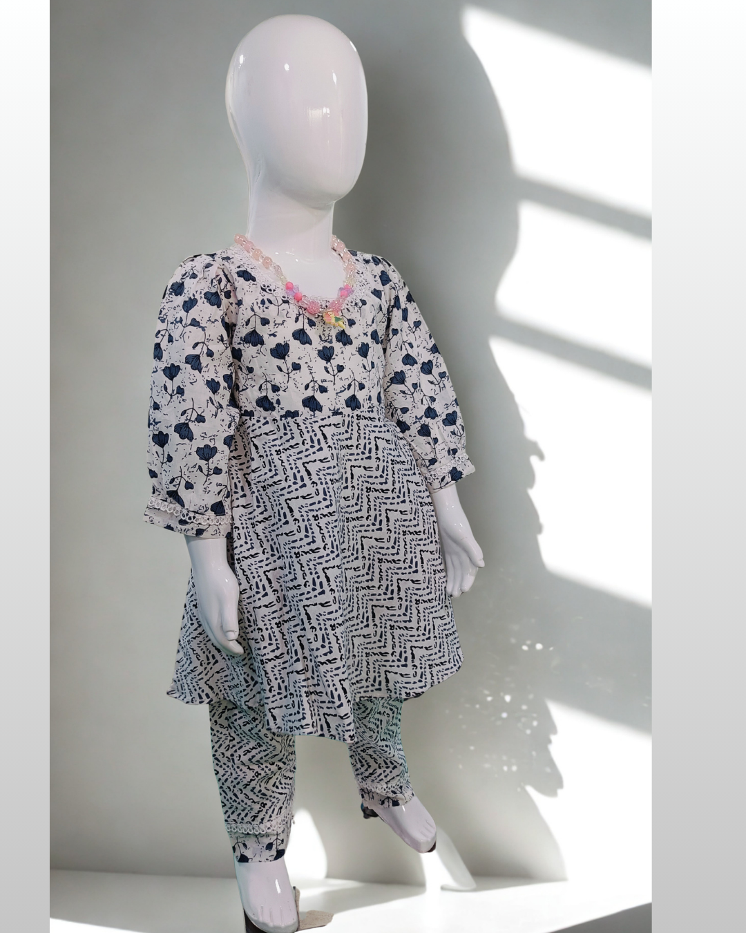 Marmar baby girl kurti set, cream base, pink floral print, white moti (pearl) detailing - side view