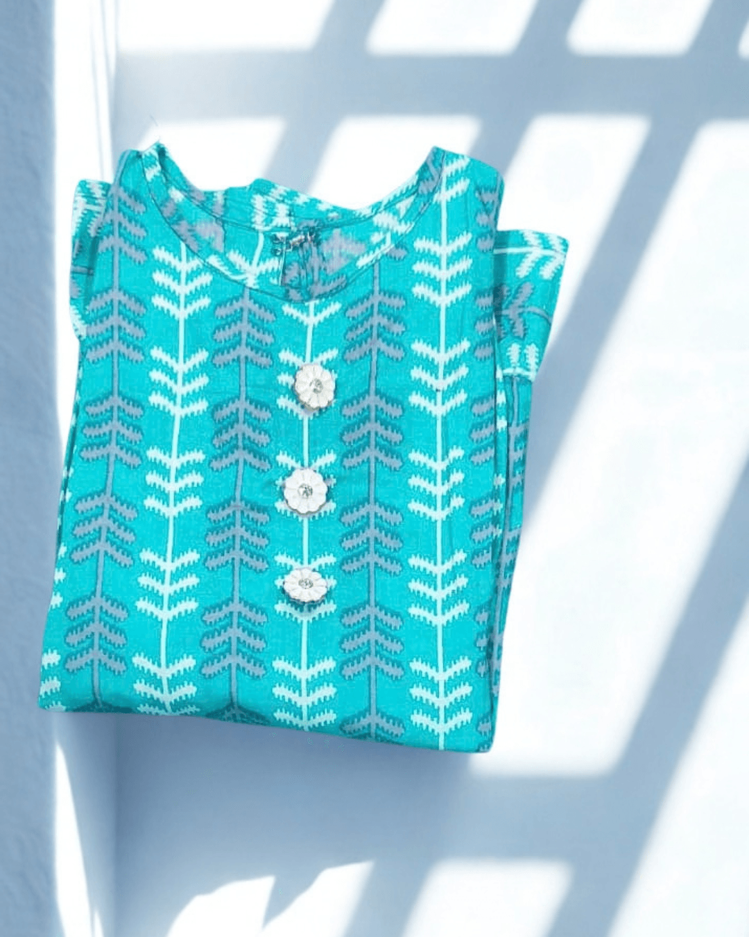 Nilofar teal chevron and leaf print cotton frock, folded