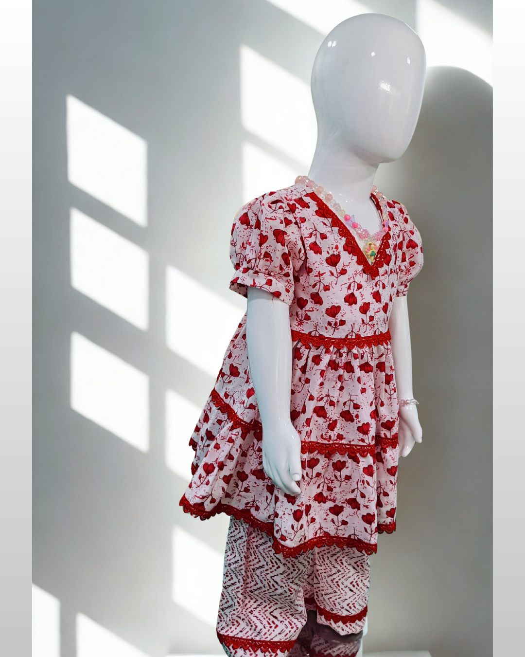 Rani baby girl kurti set, white base, small red floral print, red lace neckline - side view