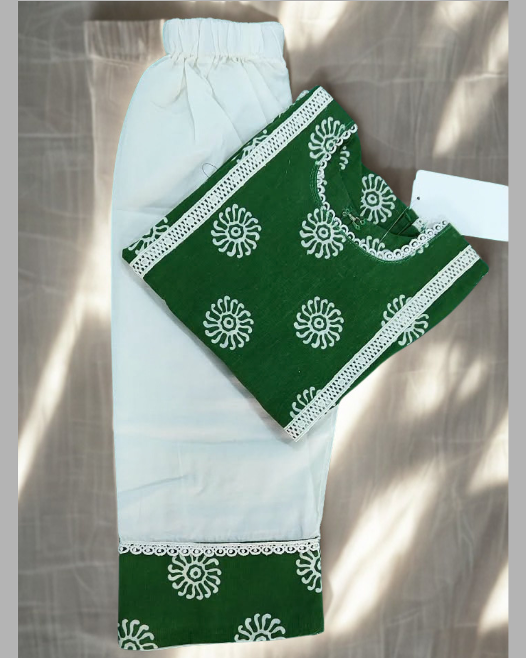 Sabza baby girl kurti set, deep green base, white mandala circle print, white lace, white palazzo - folded