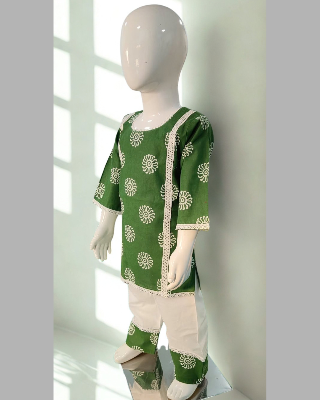 Sabza baby girl kurti set, deep green base, white mandala circle print, white lace, white palazzo - side view