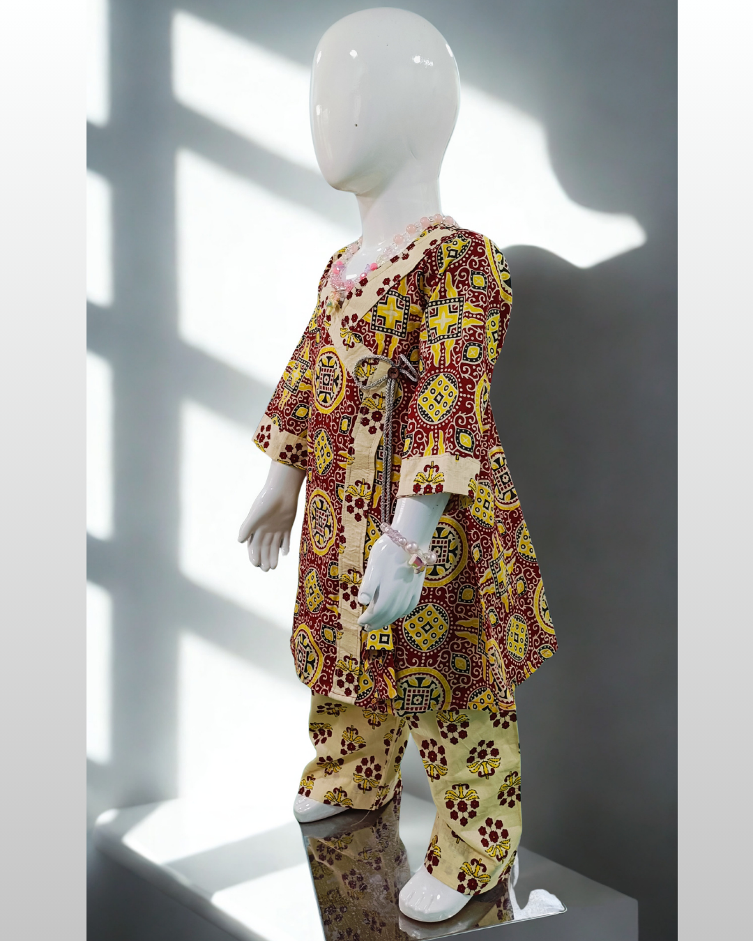 Shahzadi baby girl kurti set, white base, red floral print, front pocket, button detailing - side view