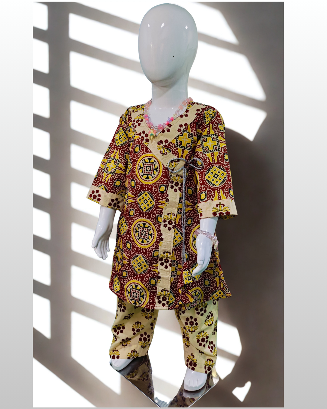 Shahzadi baby girl kurti set, white base, red floral print, front pocket, button detailing - front view