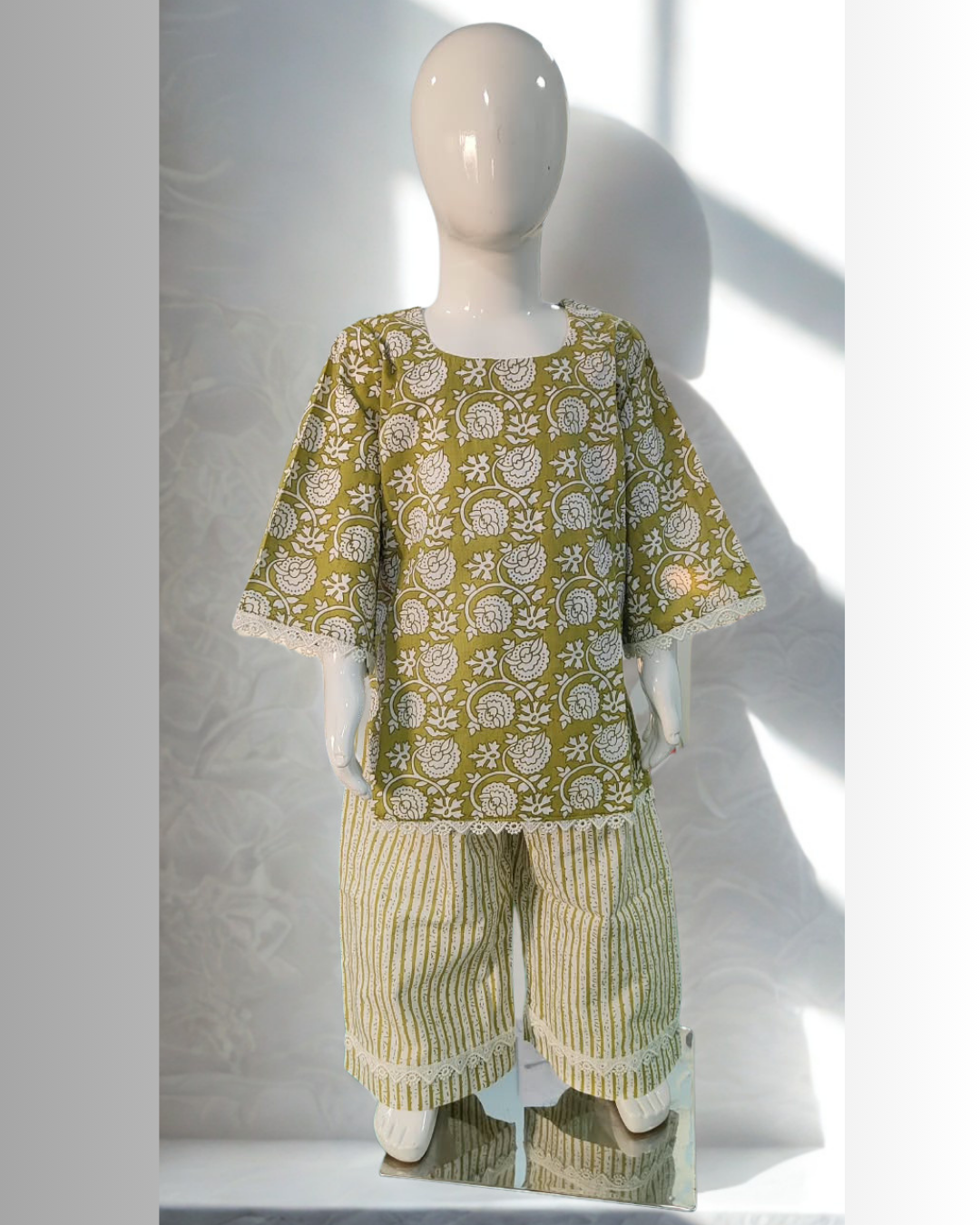 Zaitoon baby girl kurti set, blue base, white sun-motif batik print - front view