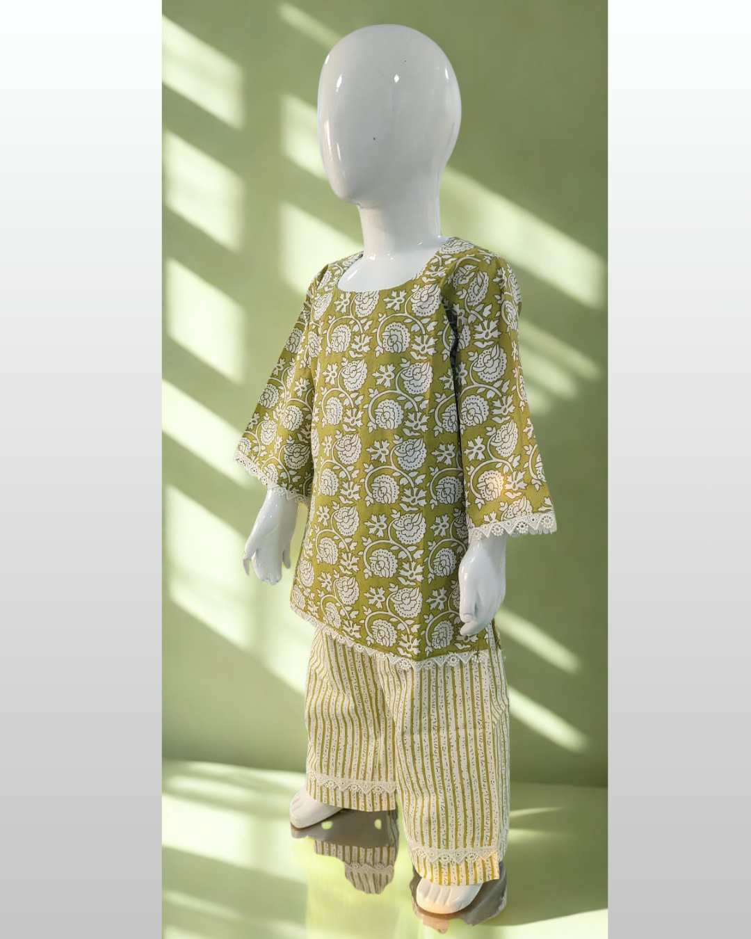 Zaitoon baby girl kurti set, blue base, white sun-motif batik print - side view