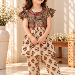 Zardozi baby girl kurti set, black base, bold ajrakh paisley print, red neckline trim - worn by a baby girl model